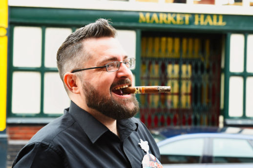 A Man celebrating his 40th with a big fat cigar