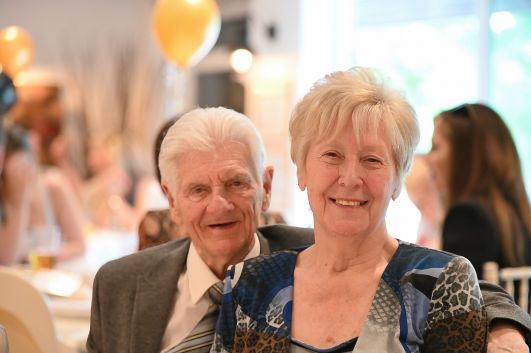 family picture at a 60th birthday party 